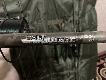 камуфляжный костюм: Карповый комплект: удилища + большие безынерционные катушки Состав: - — 10