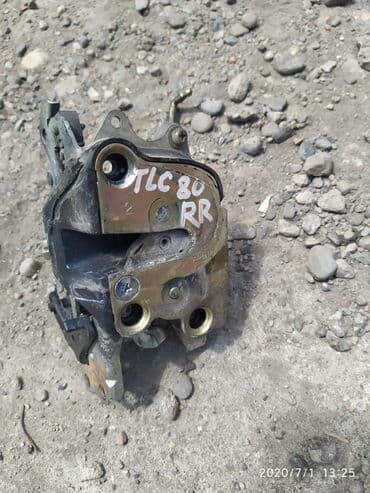 реставрация бронированных дверей: Toyota Land Cruiser 80 Замок дверной центральный, Тойота Ленд Крузер — 1