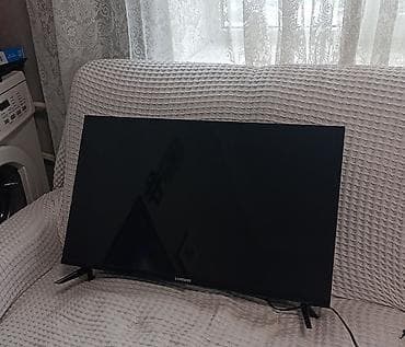 sharp aquos: Телевизор Samsung, диагональ примерно 32–40". Тонкие рамки, лаконичный — 1