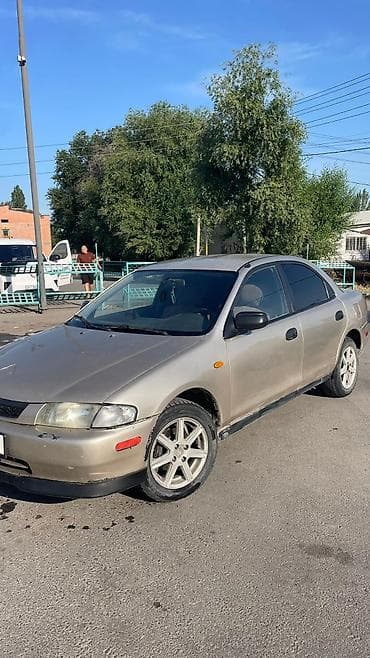 Mazda 323: 1999 г., 1.5 л, Автомат, Газ, Седан