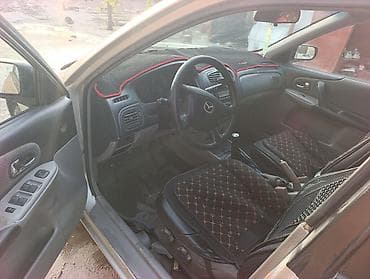 Mazda 323: 2002 г., 1.5 л, Механика, Бензин, Универсал
