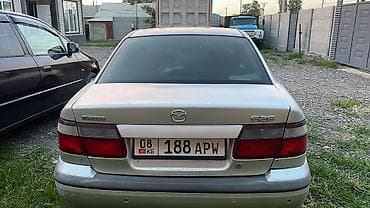 Транспорт: Mazda 626: 1997 г., 1.8 л, Механика, Газ, Седан — 4