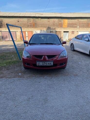 дом на калесох: Mitsubishi Lancer: 2003 г., 1.6 л, Механика, Бензиновая, Универсал — 5