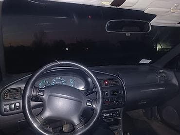 Mazda 323: 1996 г., 1.8 л, Механика, Бензин, Седан — 1