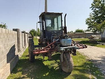 Колёсный трактор с кабиной + навесное оборудование для междурядной