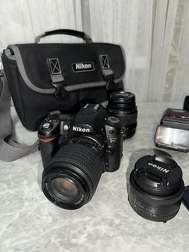 Видеокамералар: Зеркальный фотоаппарат Nikon с комплектом оптики и аксессуаров — 10