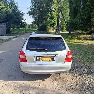 глушители авто: Mazda Familia: 1999 г., 1.5 л, Автомат, Бензин, Хэтчбэк — 4