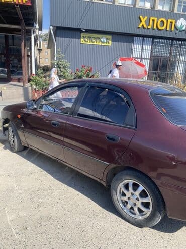 мерседес 124 2 3: Автомобиль Daewoo Lanos в кузове седан, выполненный в темно-бордовом — 4