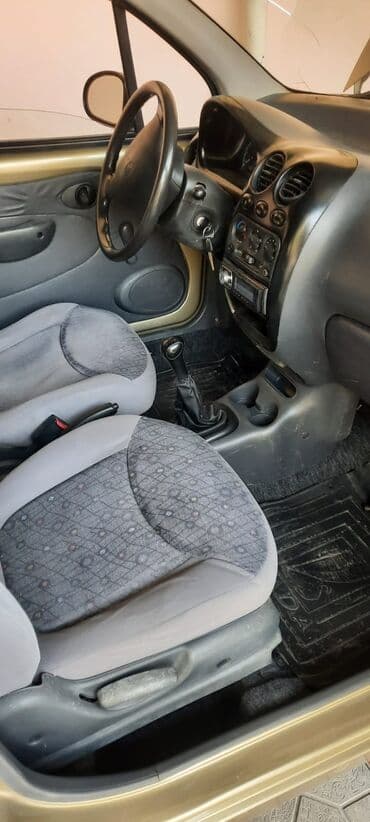 продаю в связи с переездом: Хэтчбек Daewoo Matiz в золотистом цвете, оснащенный бензиновым — 8