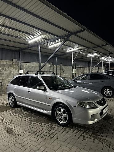 кондидер: Mazda 323: 2002 г., 2 л, Механика, Бензин, Хэтчбэк — 4