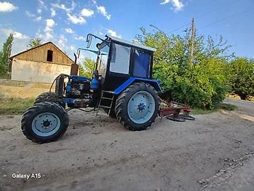 Трактор колесный с кабиной и навесным оборудованием Описание: -