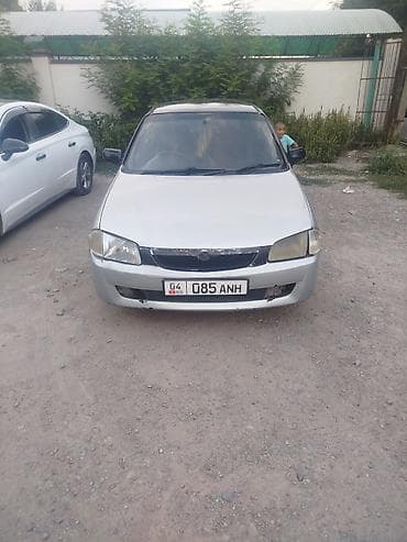 2000: Mazda 323: 1999 г., Механика, Бензин, Универсал — 2