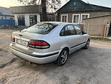 митцубиси спейс стар: Mazda 626: 1997 г., Седан — 3