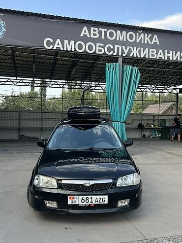 e 303: Mazda 323: 1999 г., 1.6 л, Механика, Бензин, Универсал — 2