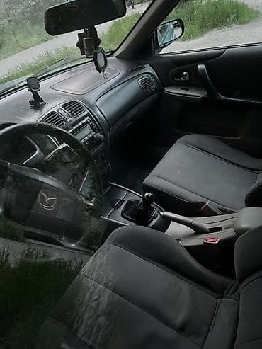 15 демио: Mazda 323: 2002 г., 1.6 л, Механика, Бензин, Хэтчбэк — 7