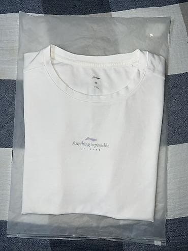 зиппо: Белая футболка Li-Ning - Бренд: Li-Ning - Надпись спереди: “Anything — 1