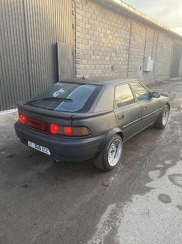 спартивный авто: Mazda 323: 1990 г., 1.6 л, Механика, Бензин, Седан — 5