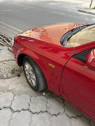 x 5: Mazda 323: 1998 г., 1.5 л, Механика, Бензин, Универсал — 6