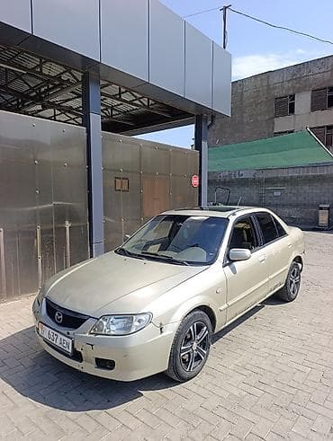 byd e7: Mazda 323: 2002 г., 1.6 л, Автомат, Бензин, Седан — 4
