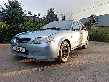 bvd e2: Mazda 323: 2003 г., 1.6 л, Механика, Бензин, Универсал — 1