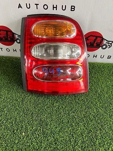 Фонарь заднего хода NISSAN March 1 1998 лев. (б/у) — 1