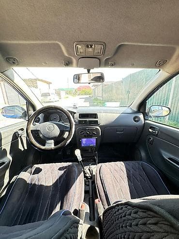 Унаа сатуу: Daihatsu Cuore: 2003 г., 1 л, Кол менен иштөөчү, Бензин, Хетчбек — 5