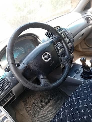 6: Mazda 323: 2001 г., 1.6 л, Механика, Бензин, Хэтчбэк — 5