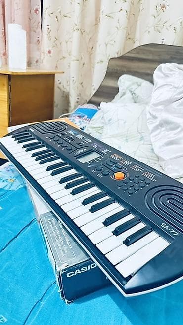 Спорт жана хобби: Синтезатор Casio SA‑77 (мини-клавиши) - 44 мини‑клавиши - Встроенный — 3