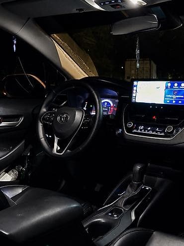 byd e2 2019: Toyota Corolla: 2023 г., 1.8 л, Вариатор, Гибрид, Седан — 10