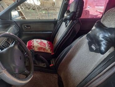 доставка аккумулятора бишкек: Просторный минивэн белого цвета с рейлингами на крыше — 2