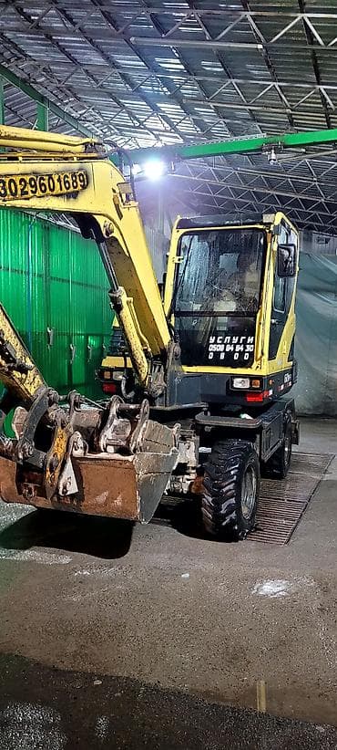 работа на экскаватор: Услуги колесного мини-экскаватора - Компактный экскаватор-погрузчик — 1