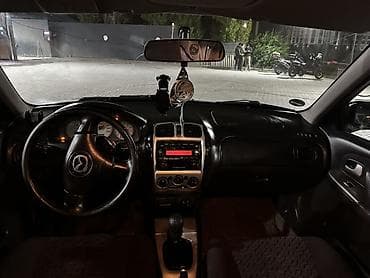 кондидер: Mazda 323: 2002 г., 2 л, Механика, Бензин, Хэтчбэк — 7