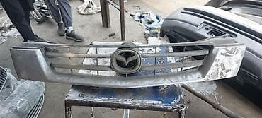 решетка на дверь: Решетка радиатора Mazda Оригинал — 4