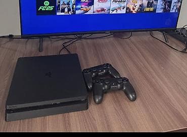 umd диски: PlayStation 4 Slim (черная) с двумя беспроводными геймпадами DualShock — 1