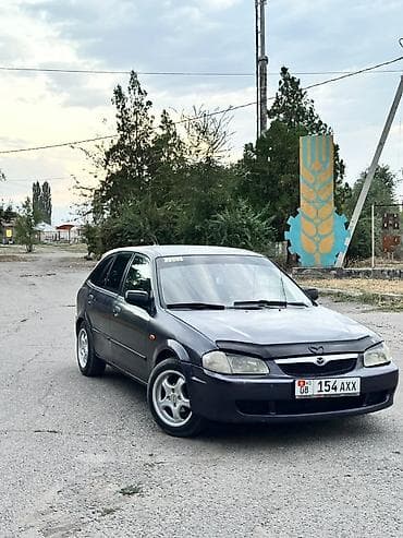 in car: Mazda 323: 1999 г., Бензин, Хэтчбэк — 3