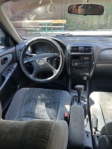Унаа сатуу: Mazda 626: 1999 г., 1.8 л, Кол менен иштөөчү, Бензин, Седан — 9