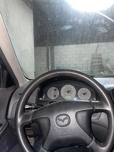 кузов нексия 2: Mazda 323: 1999 г., 1.6 л, Механика, Бензин, Седан — 8