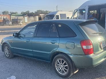 Транспорт: Mazda 323: 2003 г., 1.6 л, Автомат, Бензин, Универсал — 4