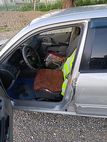 tyre master: Mazda 323: 2003 г., 1.3 л, Ручные, Бензин, Универсал — 6