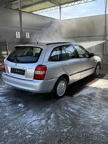 mercedesbenz 211: Mazda 323: 2000 г., Механика, Бензин, Универсал — 5