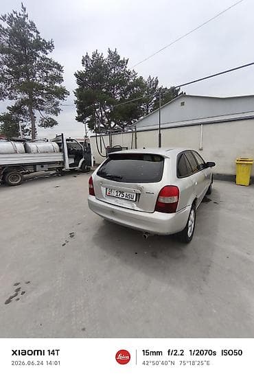 Mazda Familia: 2001 г., Универсал — 2