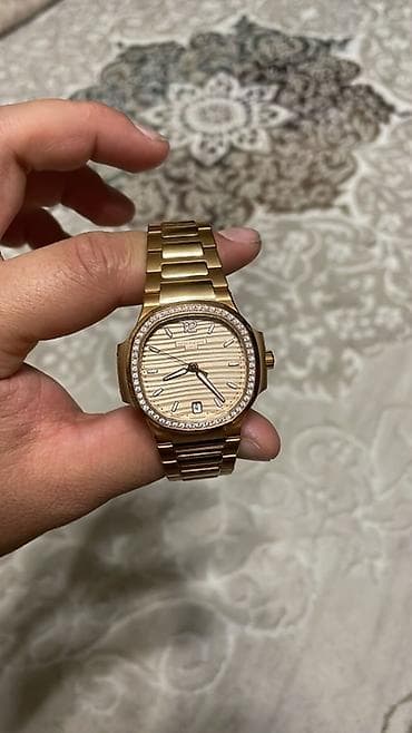 constantine meteor: Наручные часы Patek Philippe Nautilus в корпусе и браслете из розового — 1
