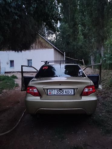 рассрочка авто бишкек без первоначального взноса: Автомобиль седан золотистого цвета. Основные особенности: - Кузов — 1