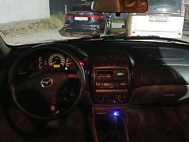 мотор 323: Mazda 323: 2001 г., Седан — 7