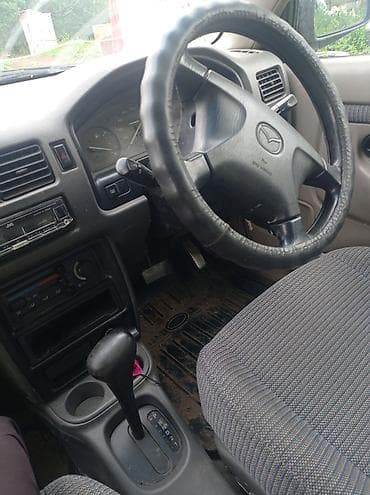 сктер: Mazda Demio: 1998 г., 1.3 л, Автомат, Бензин, Универсал — 6