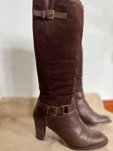 обувь для охоты: Пара коричневых сапог до колена. Изготовлены из натуральной кожи и — 1