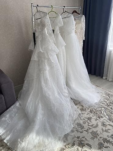 Пышное свадебное платье с длинными рукавами и богатым декором - — 3