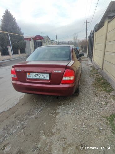 тюнинг на авто: Mazda 323: 2003 г., Автомат, Седан — 5