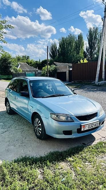 Транспорт: Mazda Familia: 2001 г., 1.5 л, Автомат, Бензин, Универсал — 4