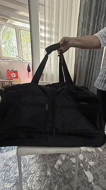 pull and beer: Большая дорожная сумка на колесах, черная. Характеристики: - Формат — 1